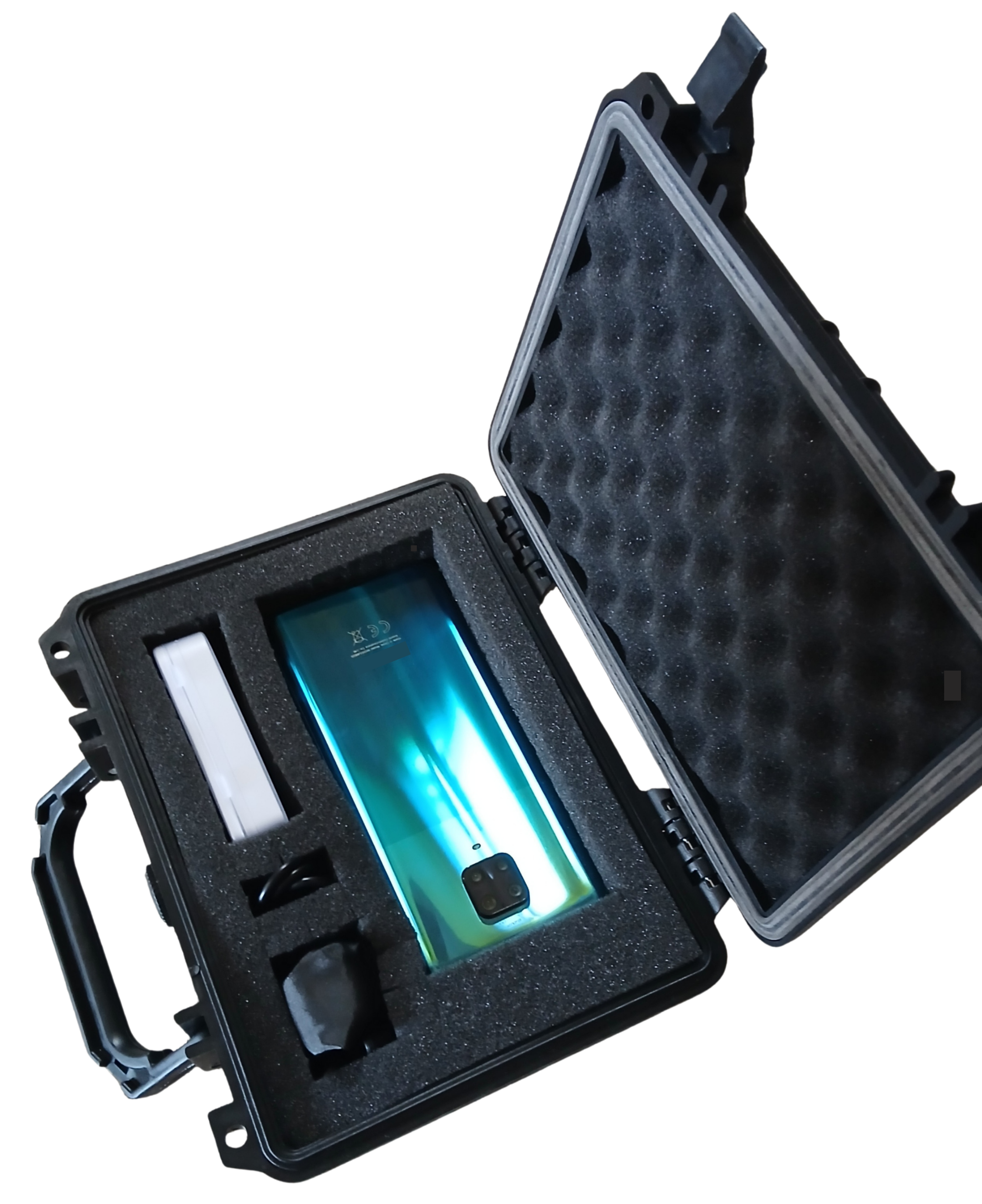 Open STOMmini kit containing a smartphone, calibration slide and clip-on lens